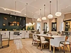 Dining space after a hospitality fit-out with plastered walls and ceiling
