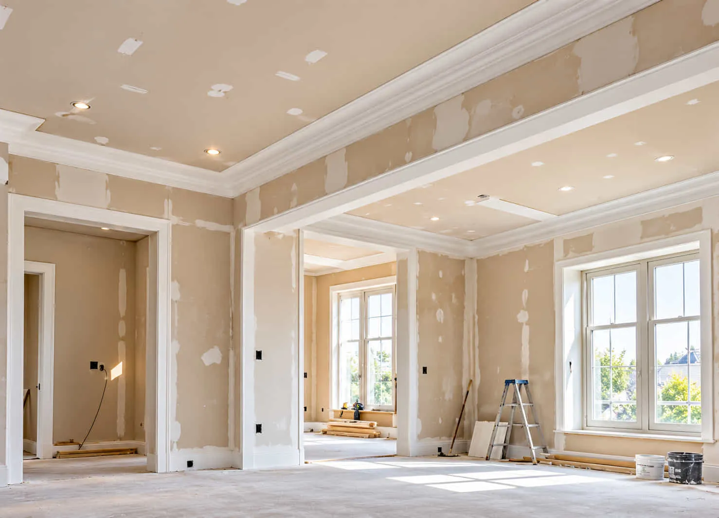 Room with new plasterboard walls and ceiling ready for finishing
